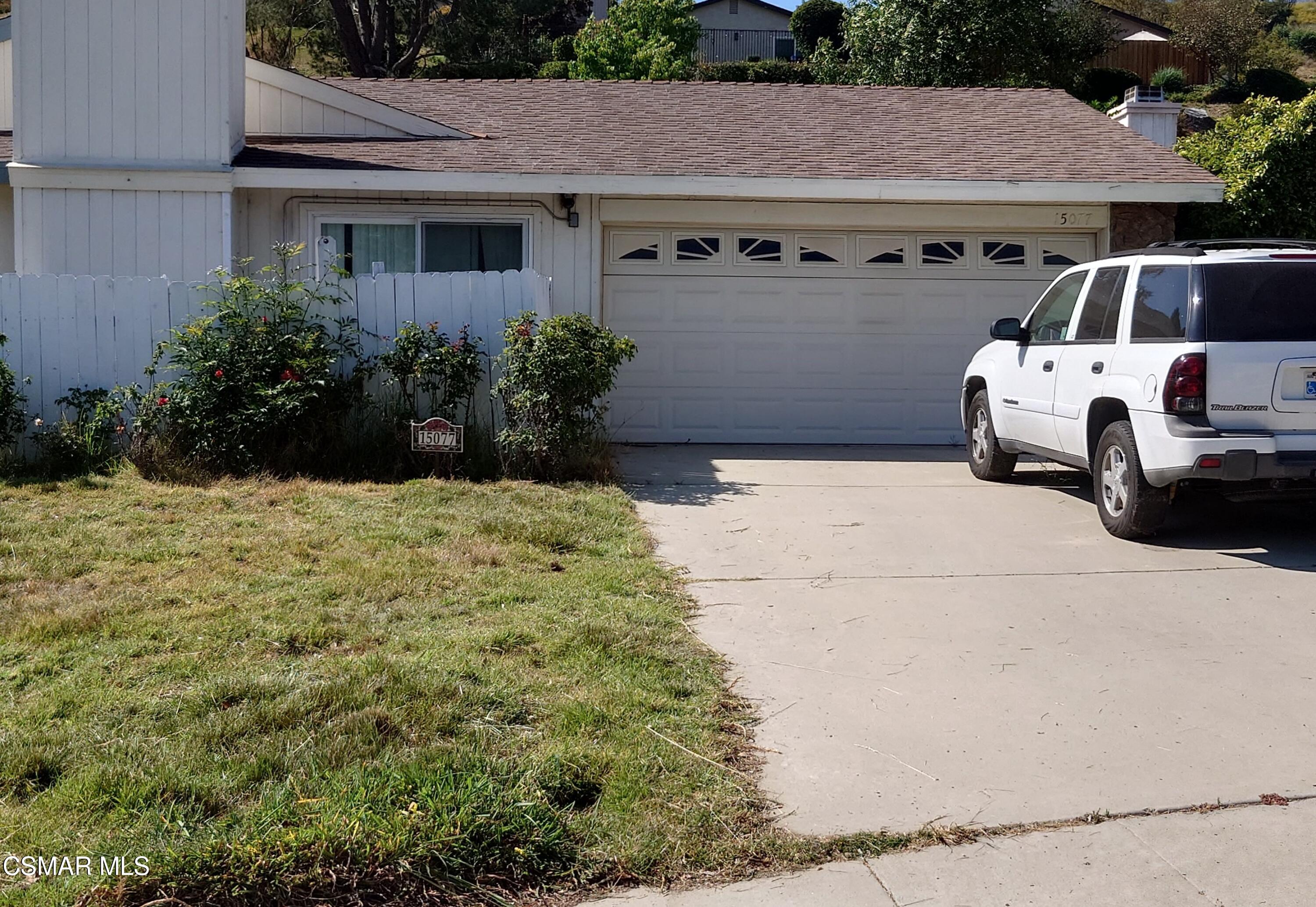 15077 Reedley Street Moorpark, CA 93021 - Photo 1 of 1 a view of a house with barbeque and wooden fence