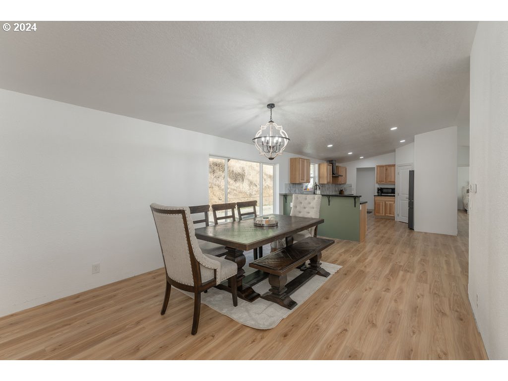 1069 Spring Brook Road Myrtle Creek, OR 97457 - Photo 11 of 43 a dining room with furniture and window