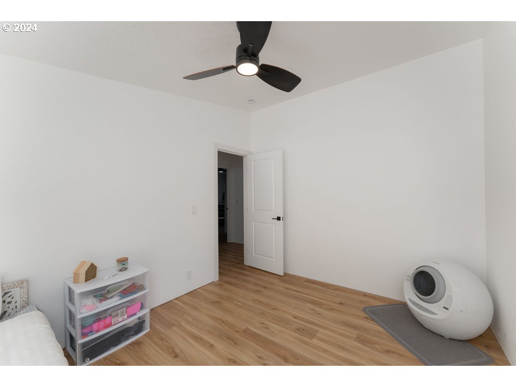 1069 Spring Brook Road Myrtle Creek, OR 97457 - Photo 23 of 43 a view of room with wooden floor