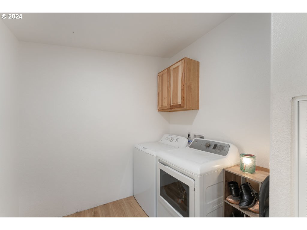 1069 Spring Brook Road Myrtle Creek, OR 97457 - Photo 29 of 43 a utility room with dryer and washer