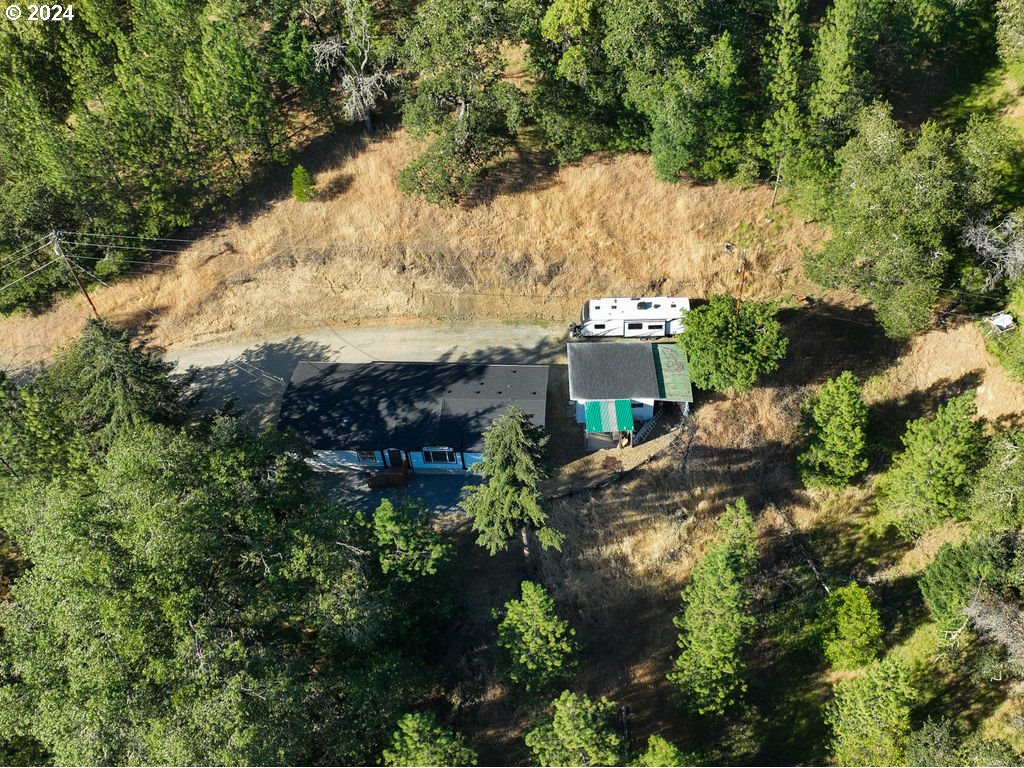 1069 Spring Brook Road Myrtle Creek, OR 97457 - Photo 30 of 43 an aerial view of a house with a yard