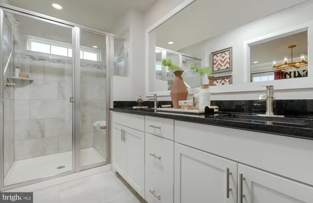 a bathroom with a double vanity sink and a mirror