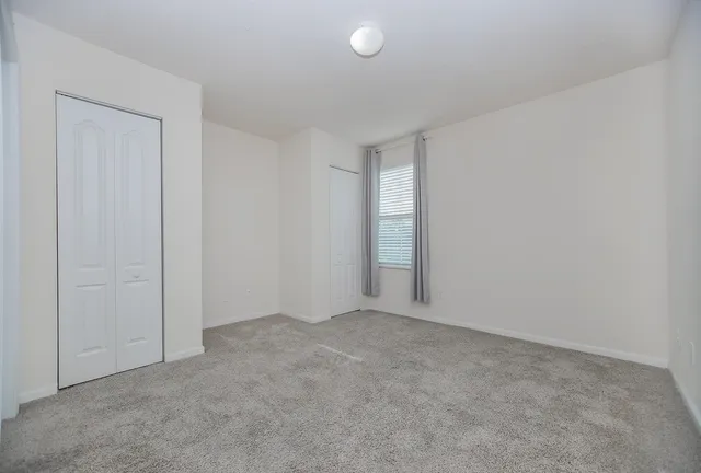 a view of an empty room and entryway