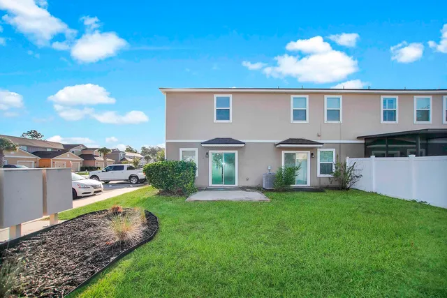a view of a house with a yard