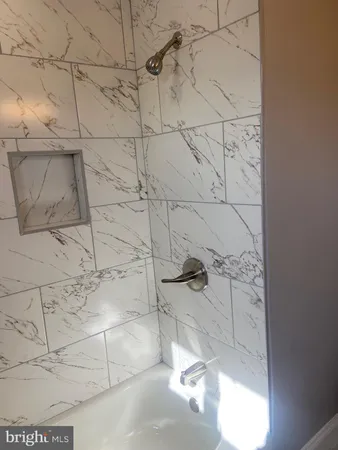 a view of city street with a car parked on the road