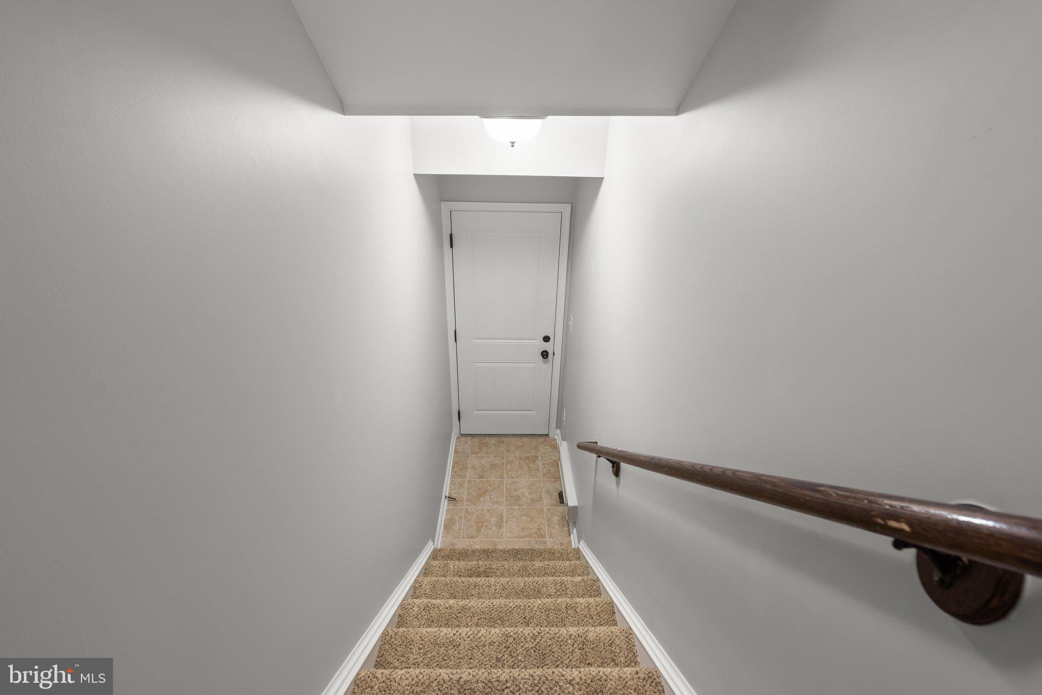 24684 Footed Ridge Terrace Sterling, VA 20166 - Photo 20 of 25 Stairs to garage door