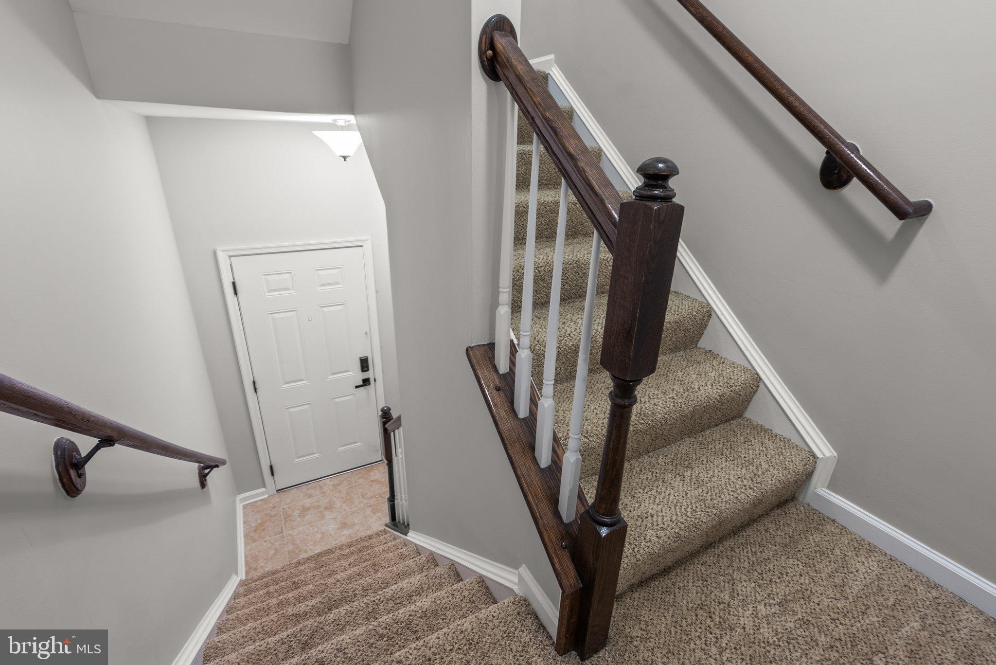Front door, stairs to the living area