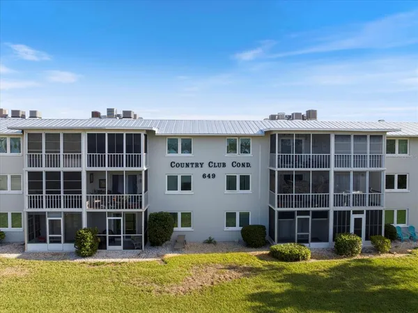 a front view of a building with swimming pool