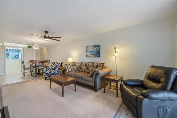 a living room with furniture and a chair