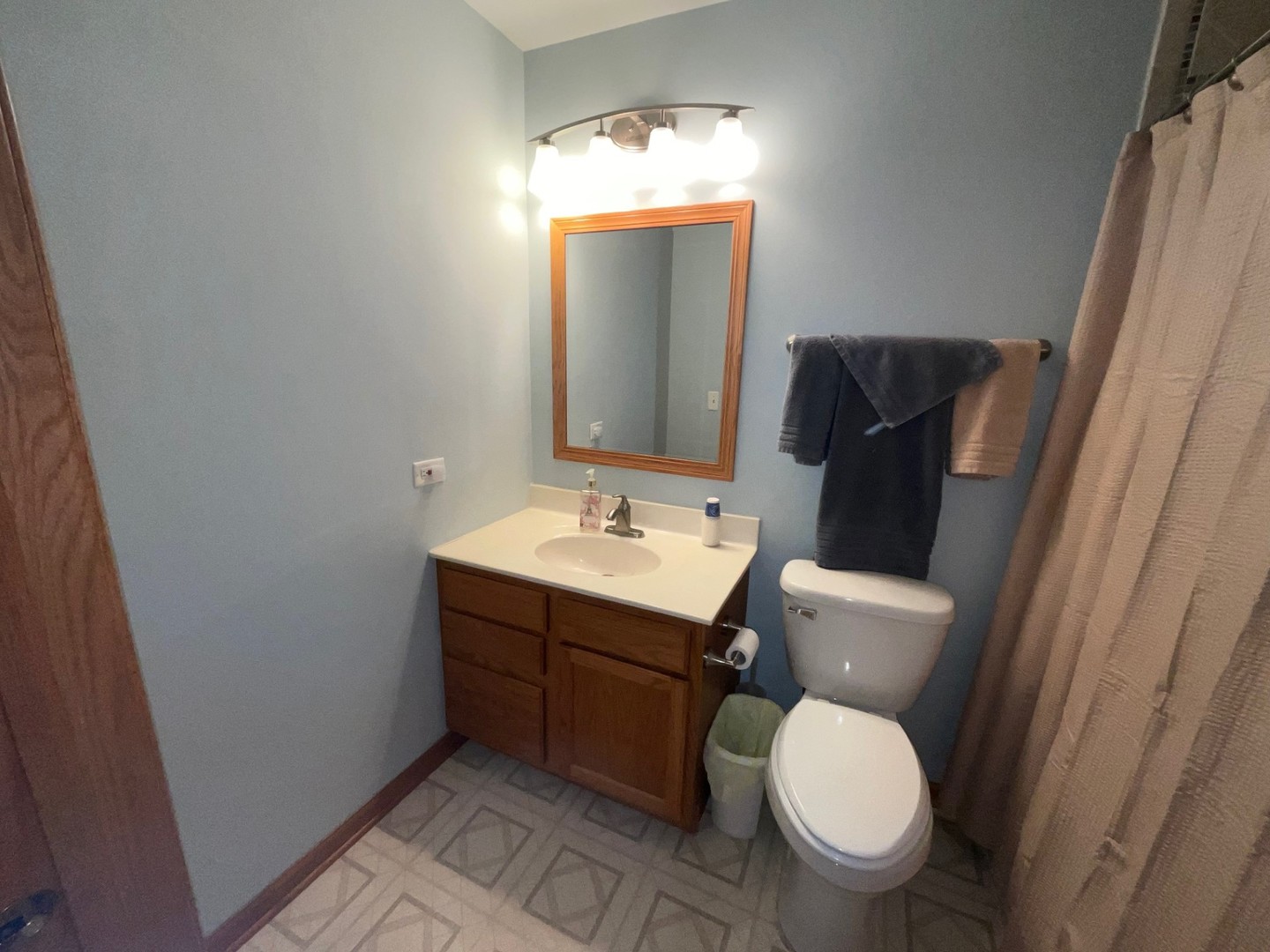 832 Coronado Court, Unit 832 Elgin, IL 60123 - Photo 13 of 20 a bathroom with a toilet sink and mirror