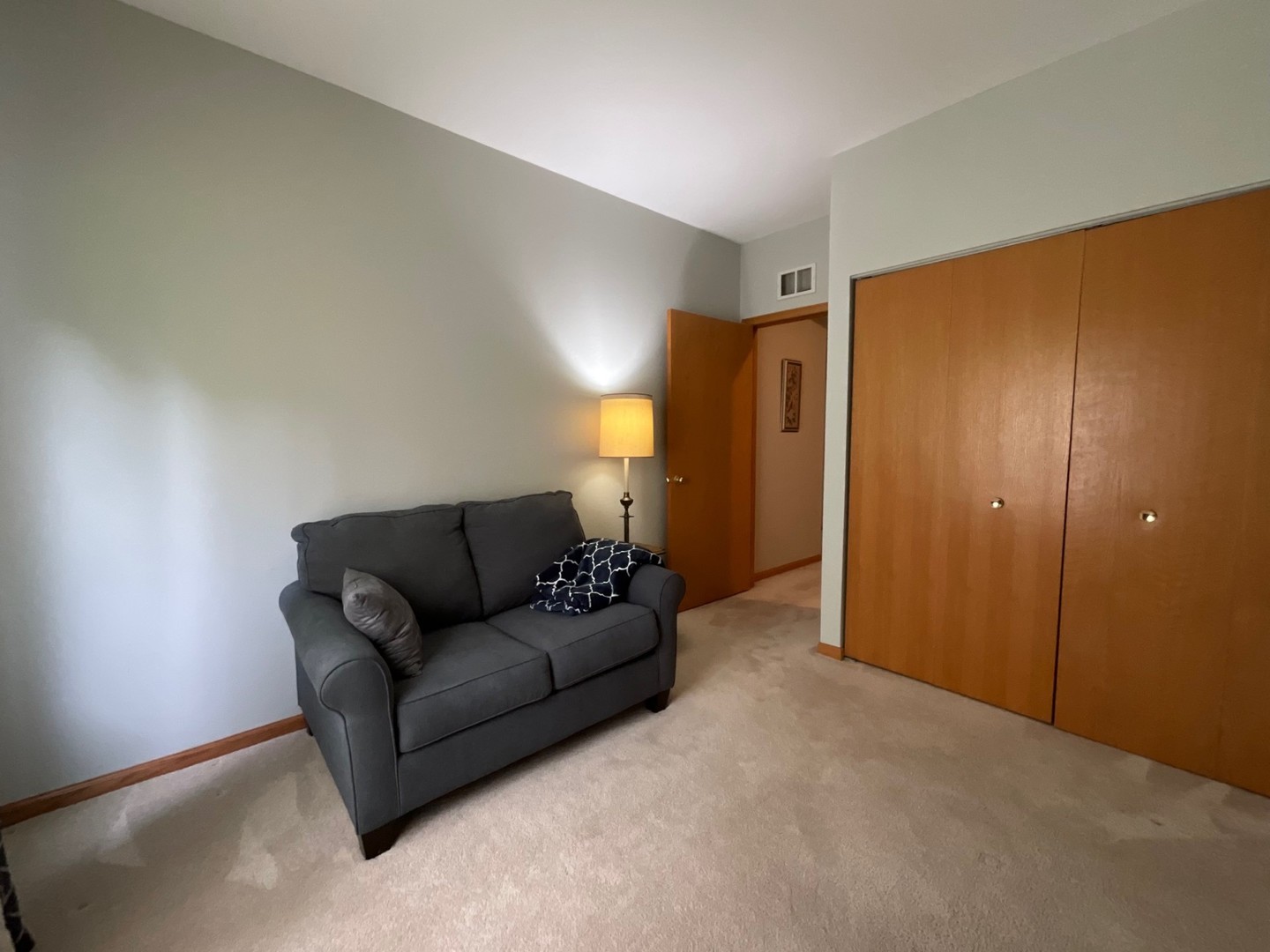 832 Coronado Court, Unit 832 Elgin, IL 60123 - Photo 14 of 20 a living room with furniture and a window