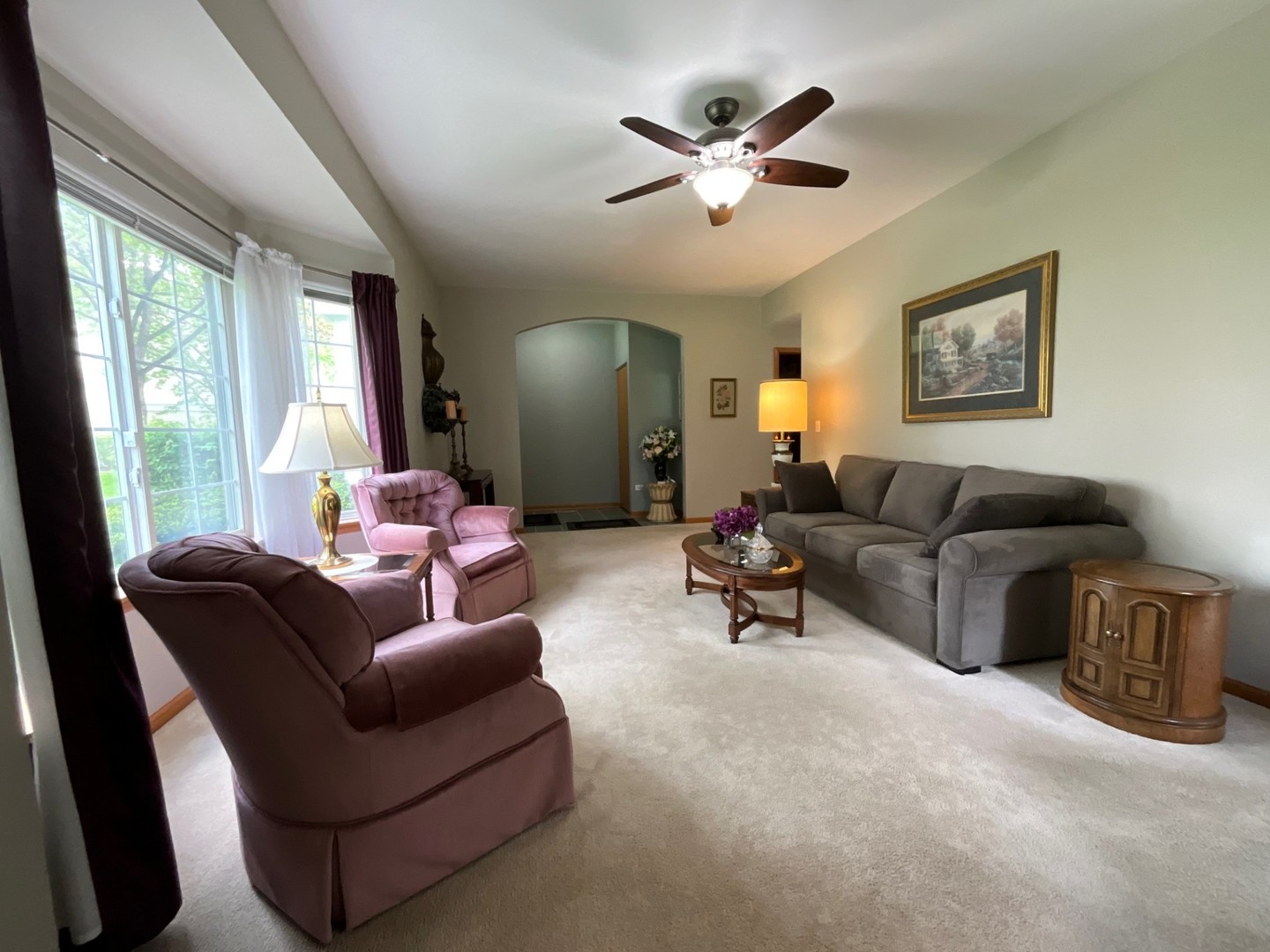 832 Coronado Court, Unit 832 Elgin, IL 60123 - Photo 5 of 20 a living room with furniture and a large window