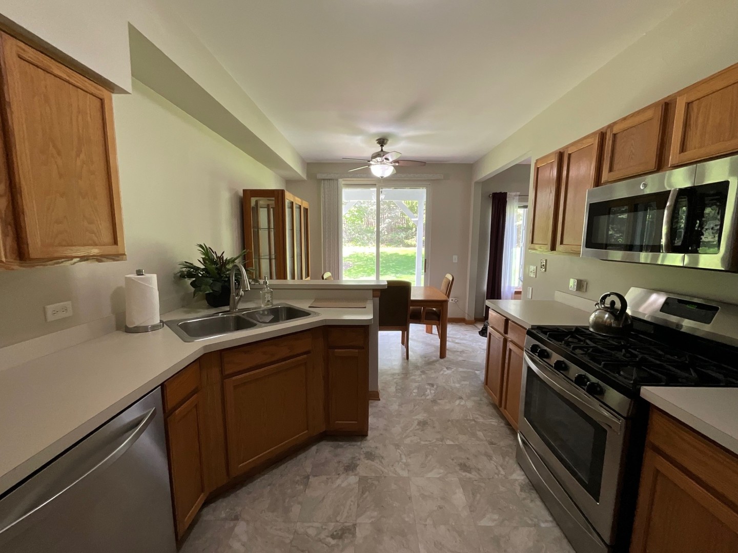 832 Coronado Court, Unit 832 Elgin, IL 60123 - Photo 9 of 20 a kitchen with a sink stove and microwave