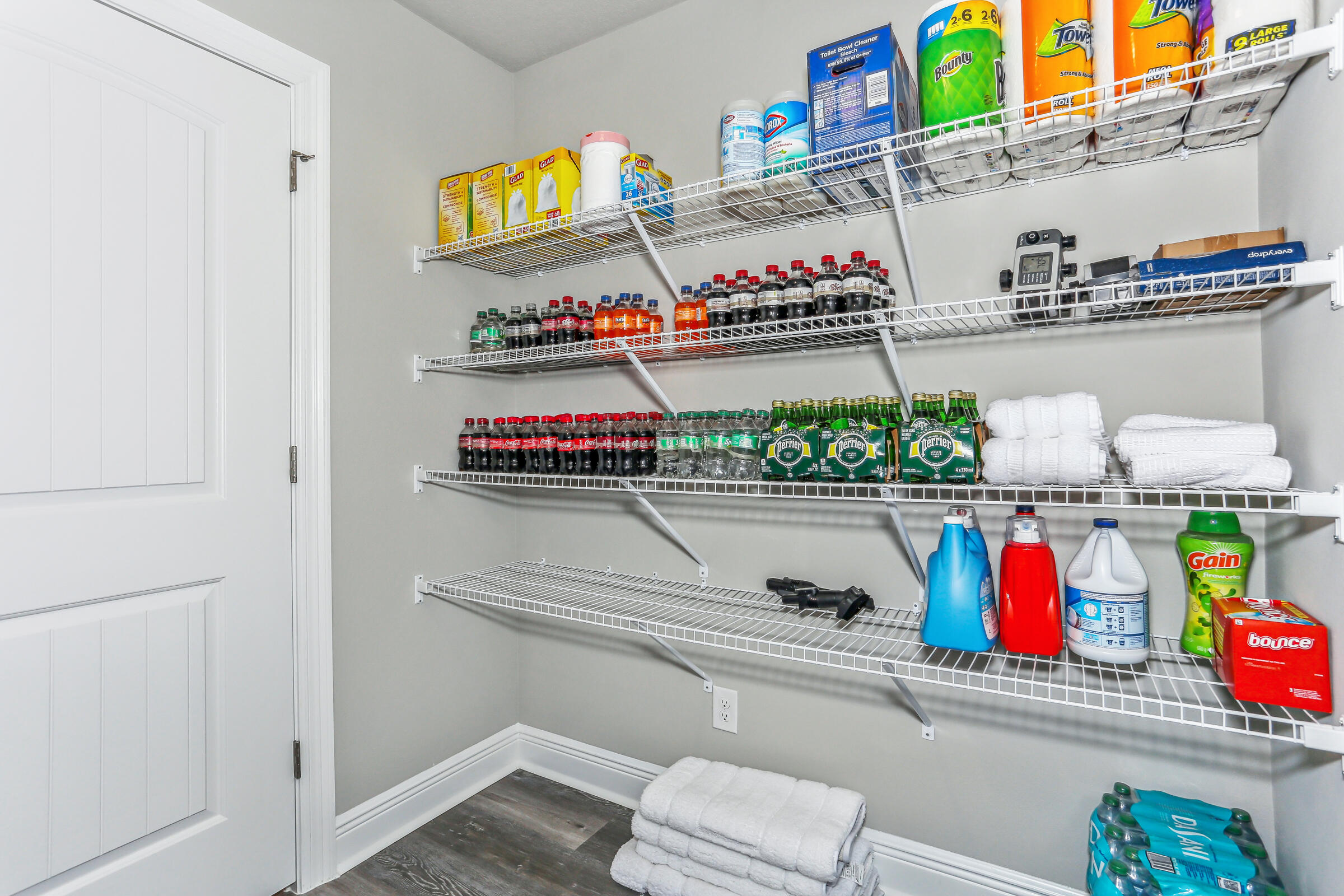 7568 Hatteras Drive Navarre, FL 32566 - Photo 25 of 44 a utility room with stainless steel appliances and racks