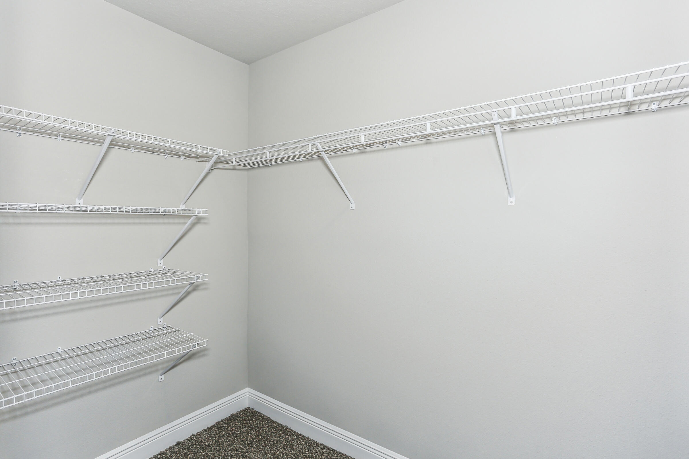 7568 Hatteras Drive Navarre, FL 32566 - Photo 34 of 44 a view of a room with racks on the wall