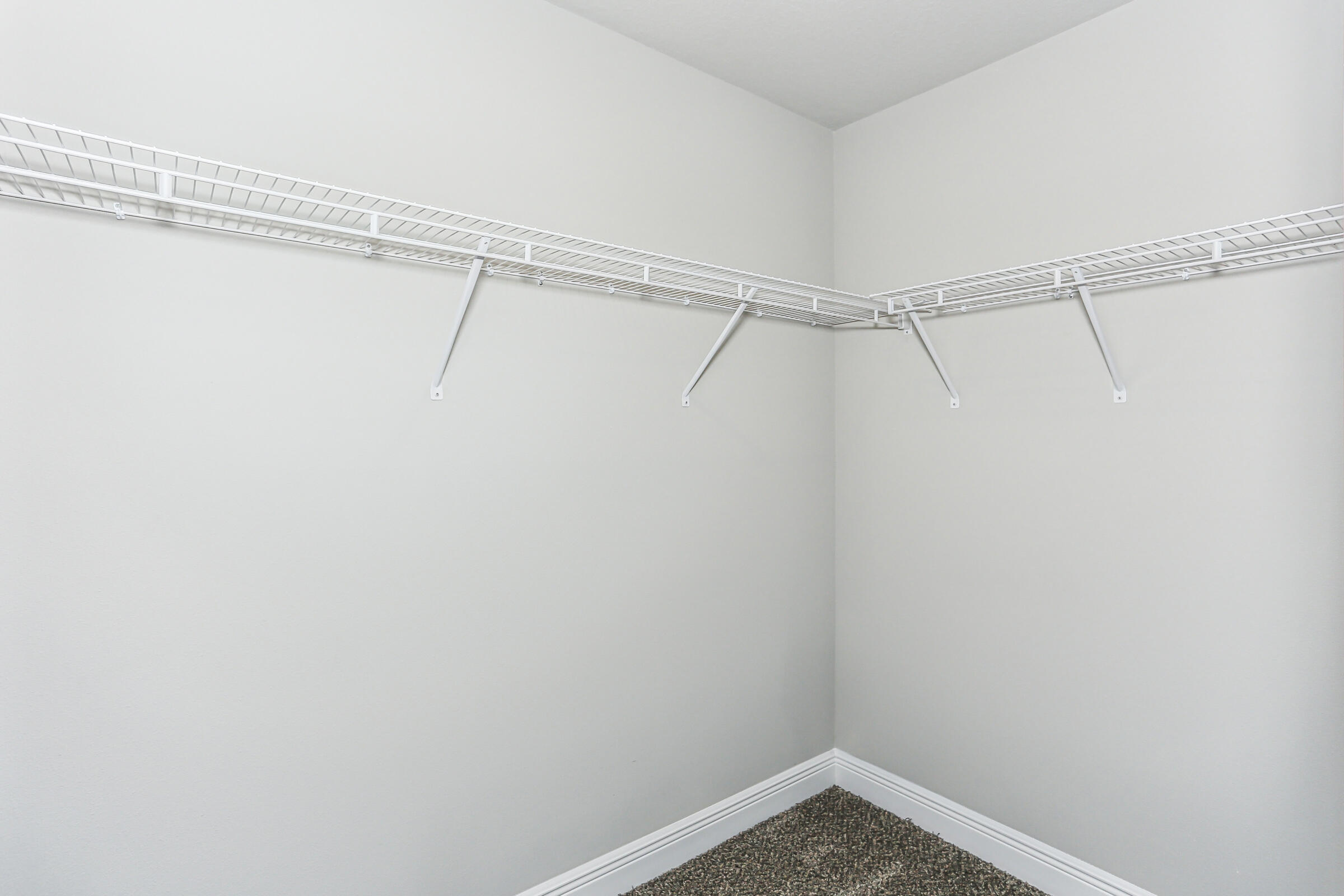 7568 Hatteras Drive Navarre, FL 32566 - Photo 35 of 44 a view of a room with racks on the wall