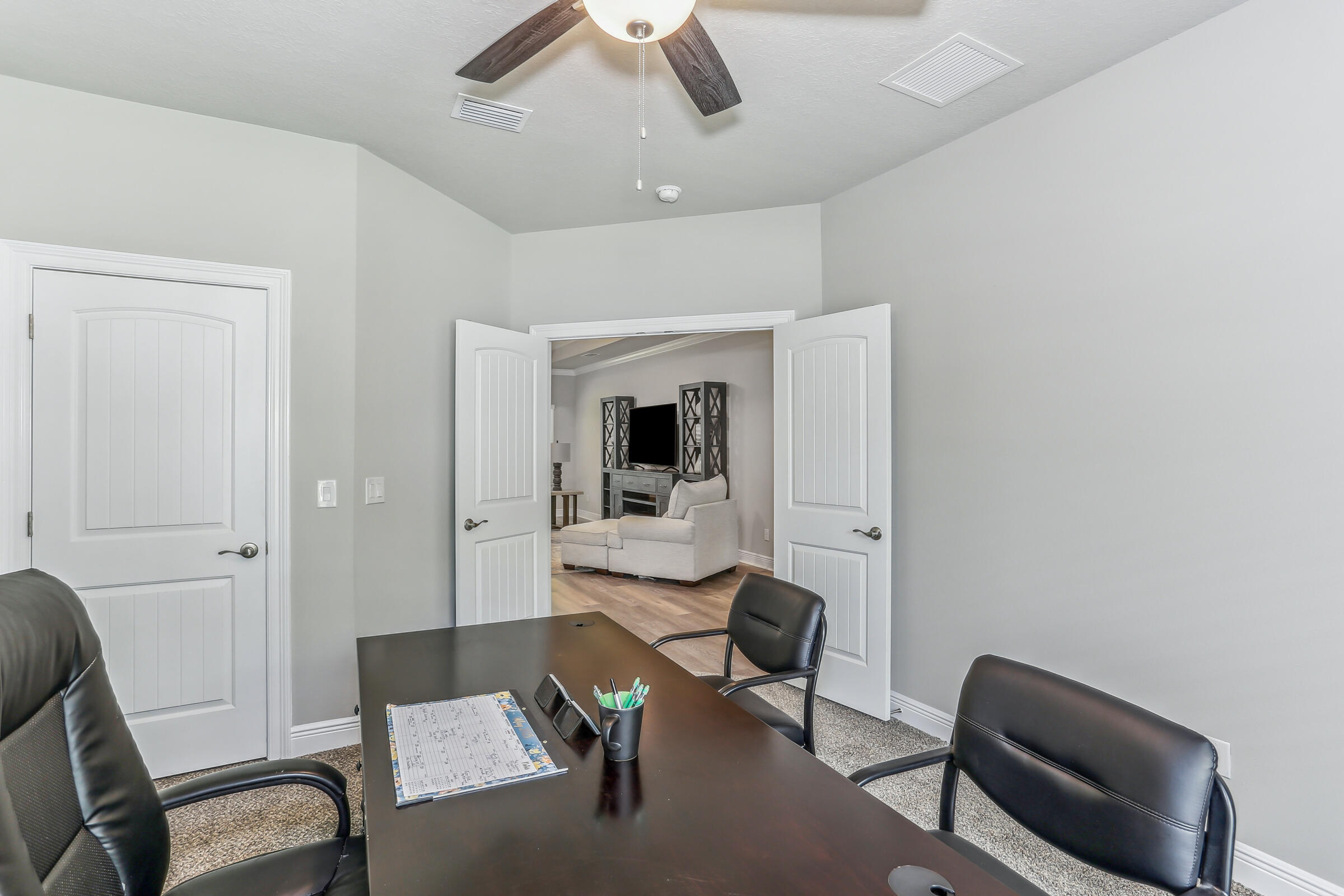 7568 Hatteras Drive Navarre, FL 32566 - Photo 42 of 44 a workspace with furniture and bedroom view