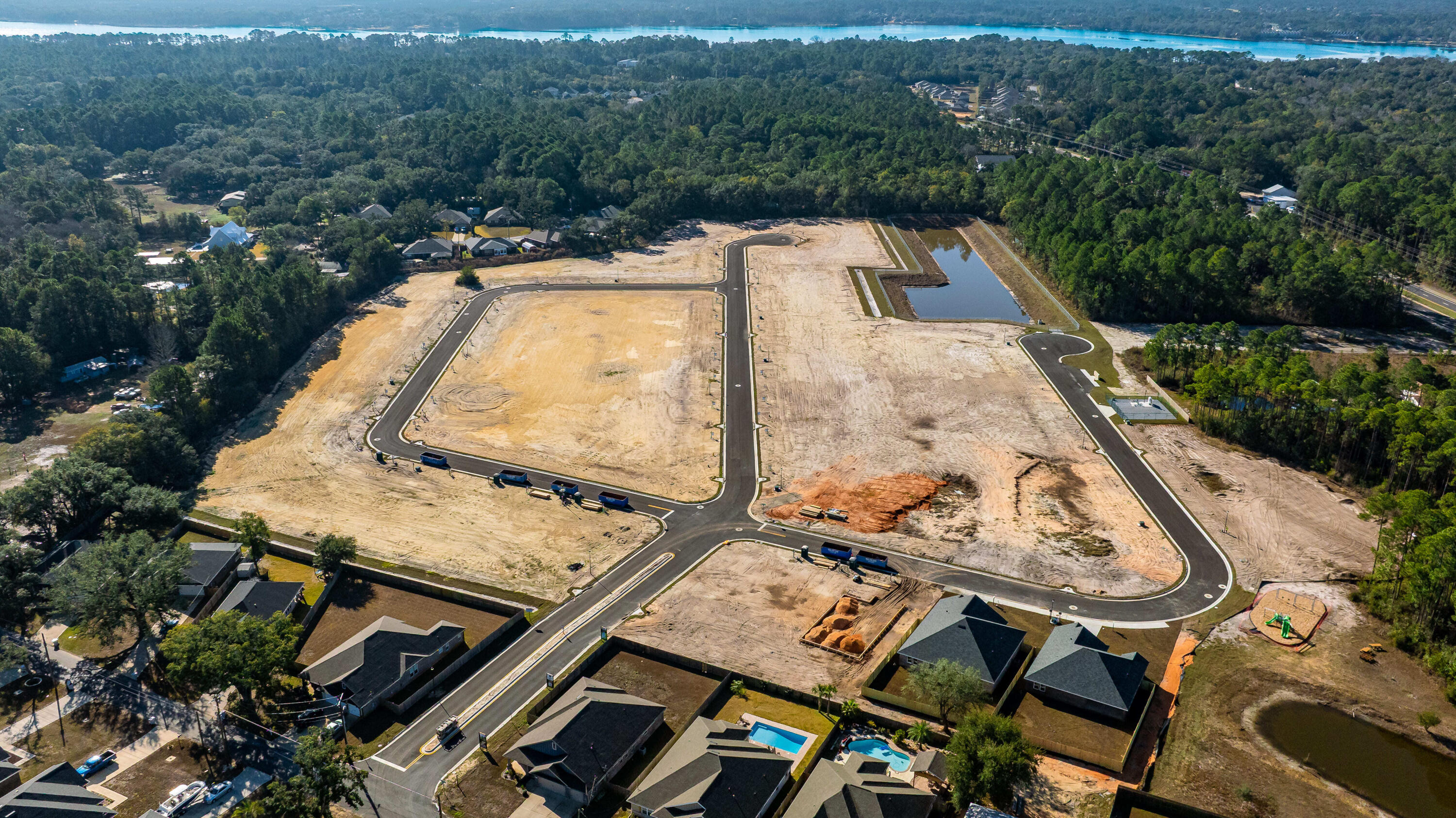 7568 Hatteras Drive Navarre, FL 32566 - Photo 8 of 44 an aerial view of a house with swimming pool and mountain view