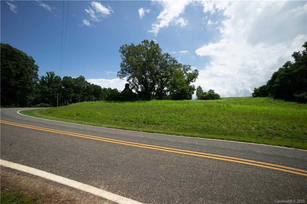 0 Jericho Road Harmony, NC 28634 - Photo 3 of 17 a view of a big yard with potted plants and big trees