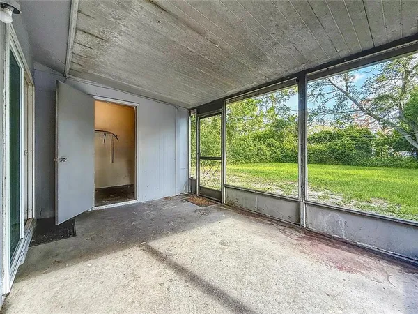 a view of a room with large windows and pool table