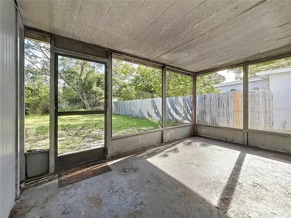 a big room with windows and closet
