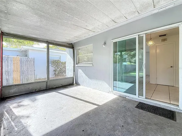 a view of an empty room with a large window