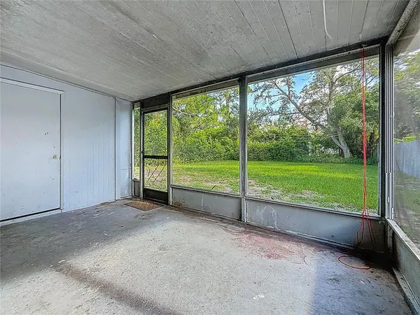a view of front door of house with outdoor seating