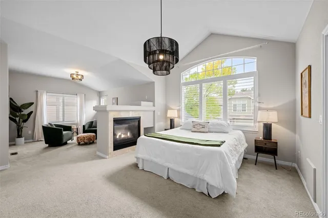 a bedroom with bed and a fireplace