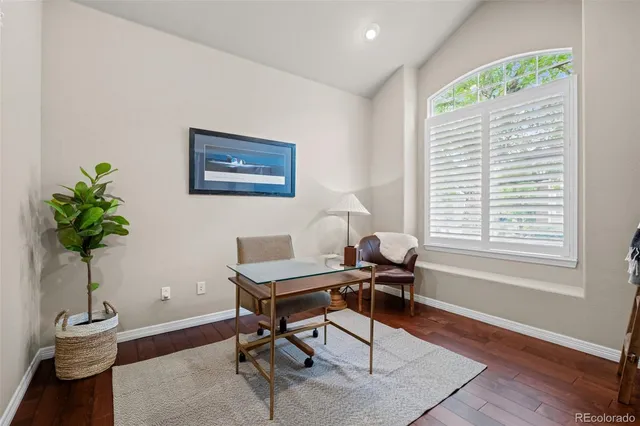 a workspace with furniture and a potted plant