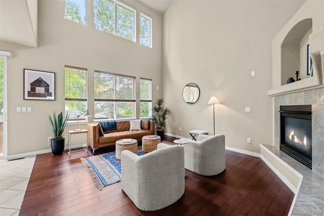 a living room with furniture fireplace and window