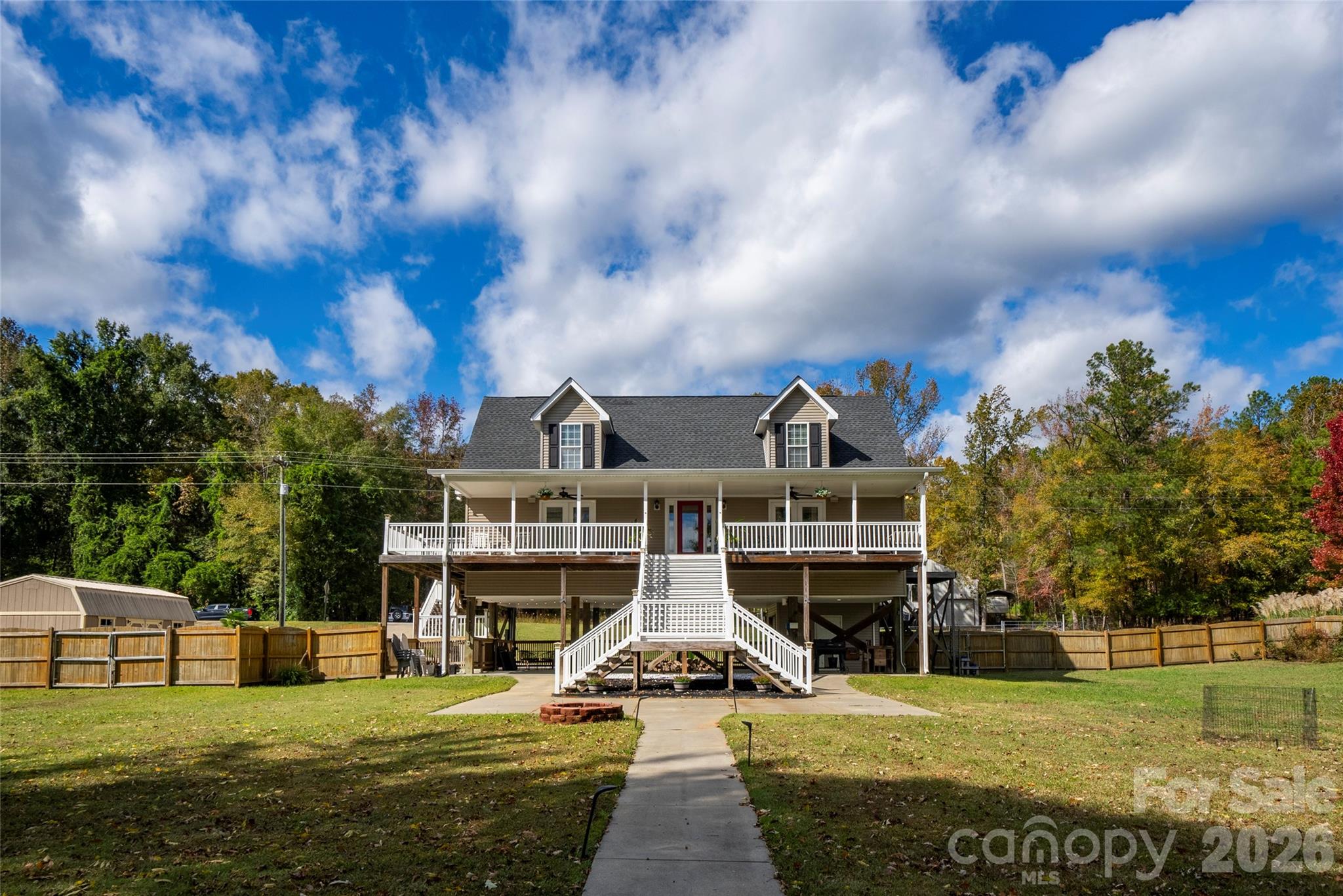 1273 State Rd S-20-317 Winnsboro, SC 29180 - Photo 1 of 48 a view of a house with a big yard and large trees