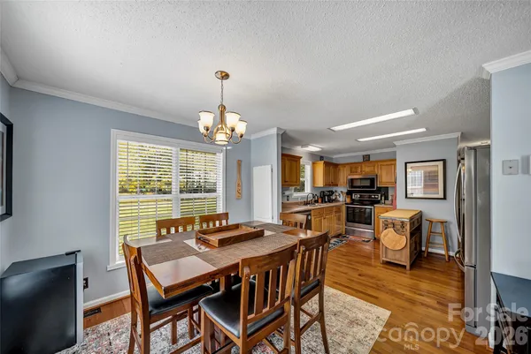 a kitchen with stainless steel appliances and wooden cabinets