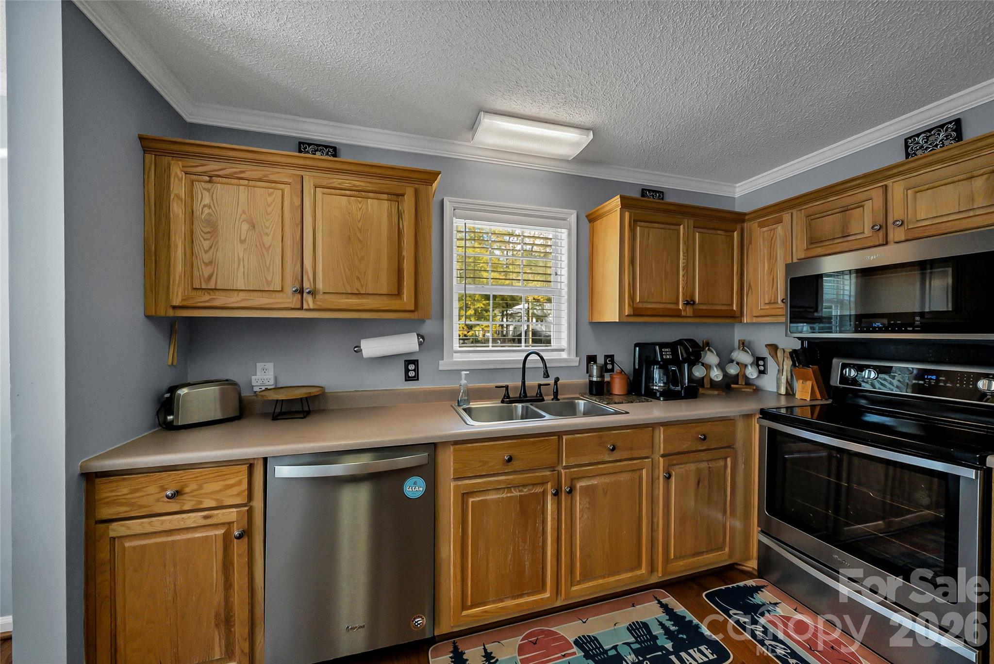 1273 State Rd S-20-317 Winnsboro, SC 29180 - Photo 18 of 48 a kitchen with stainless steel appliances granite countertop a sink stove and microwave