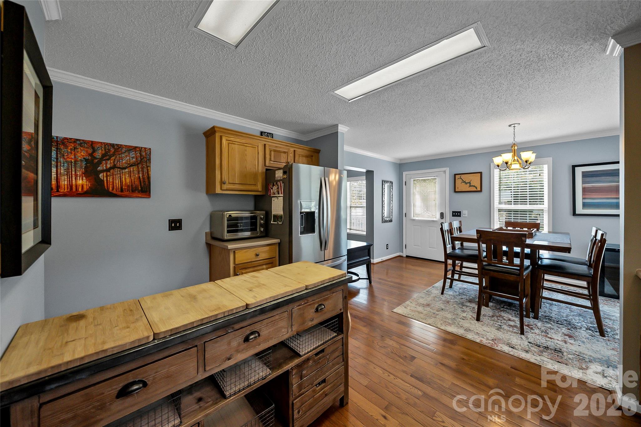 1273 State Rd S-20-317 Winnsboro, SC 29180 - Photo 20 of 48 a living room with stainless steel appliances kitchen island granite countertop furniture and a flat screen tv