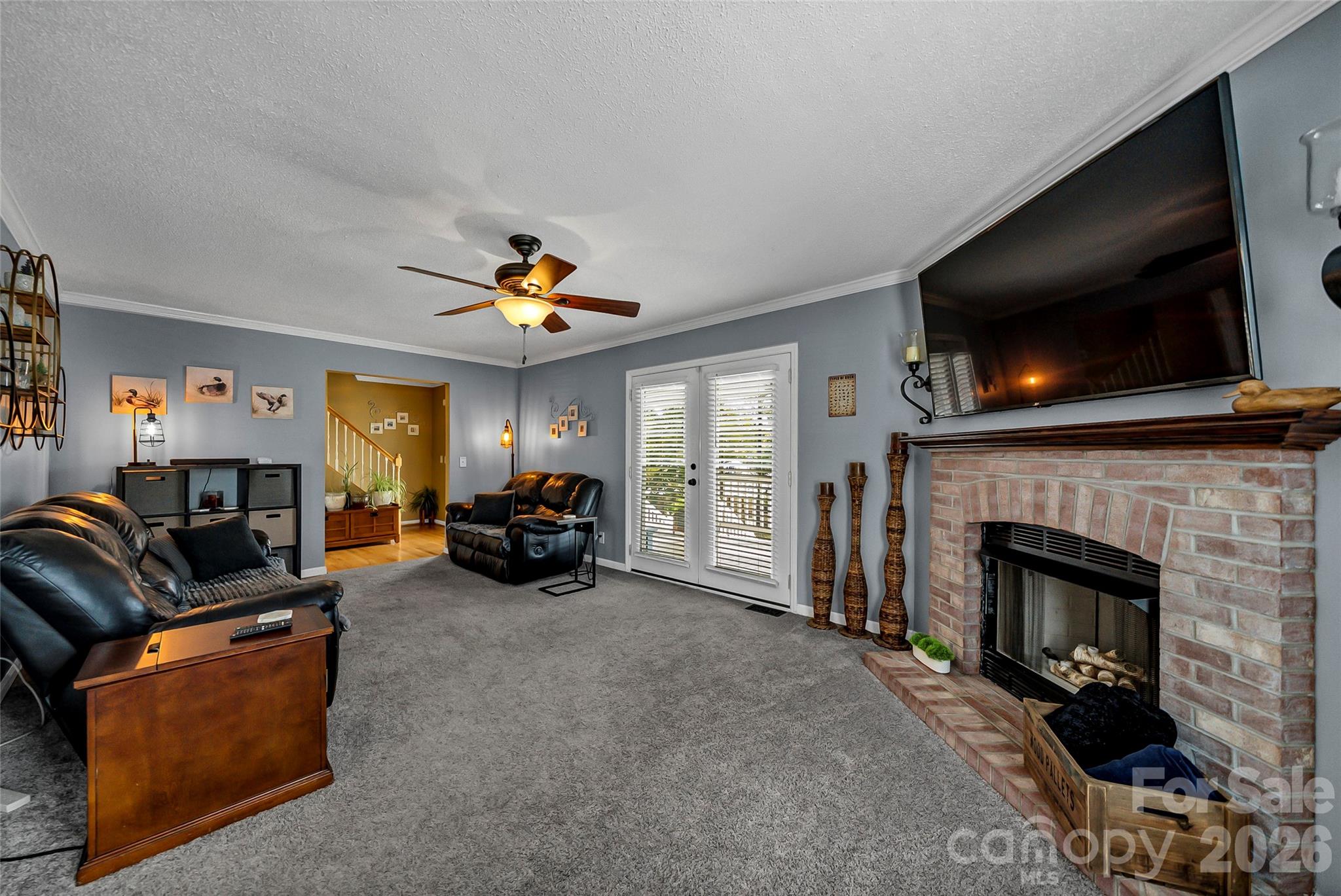 1273 State Rd S-20-317 Winnsboro, SC 29180 - Photo 29 of 48 a living room with furniture a flat screen tv and a fireplace
