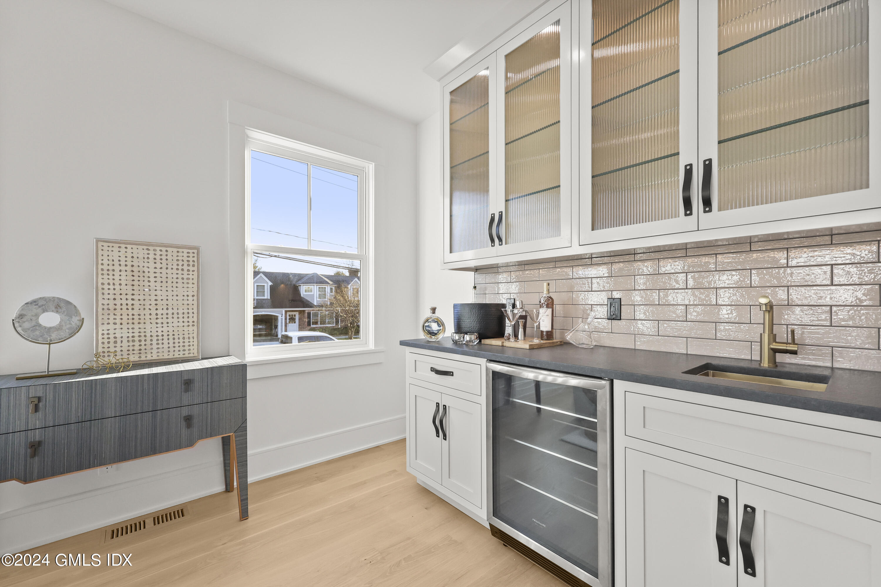 5 Northridge Road Old Greenwich, CT 06870 - Photo 14 of 32 a kitchen with stainless steel appliances a sink and cabinets
