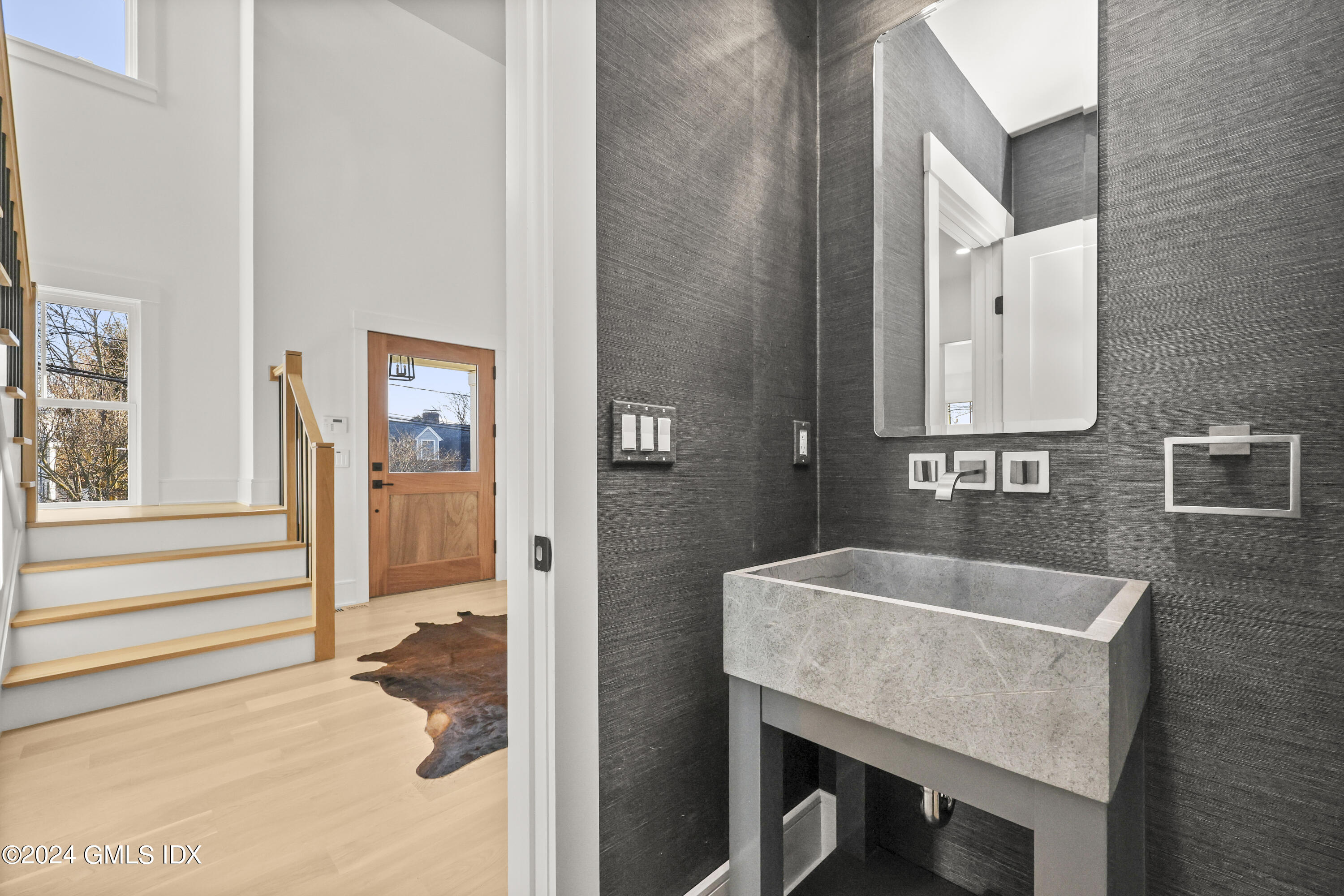 5 Northridge Road Old Greenwich, CT 06870 - Photo 21 of 32 a bathroom with a sink and a mirror