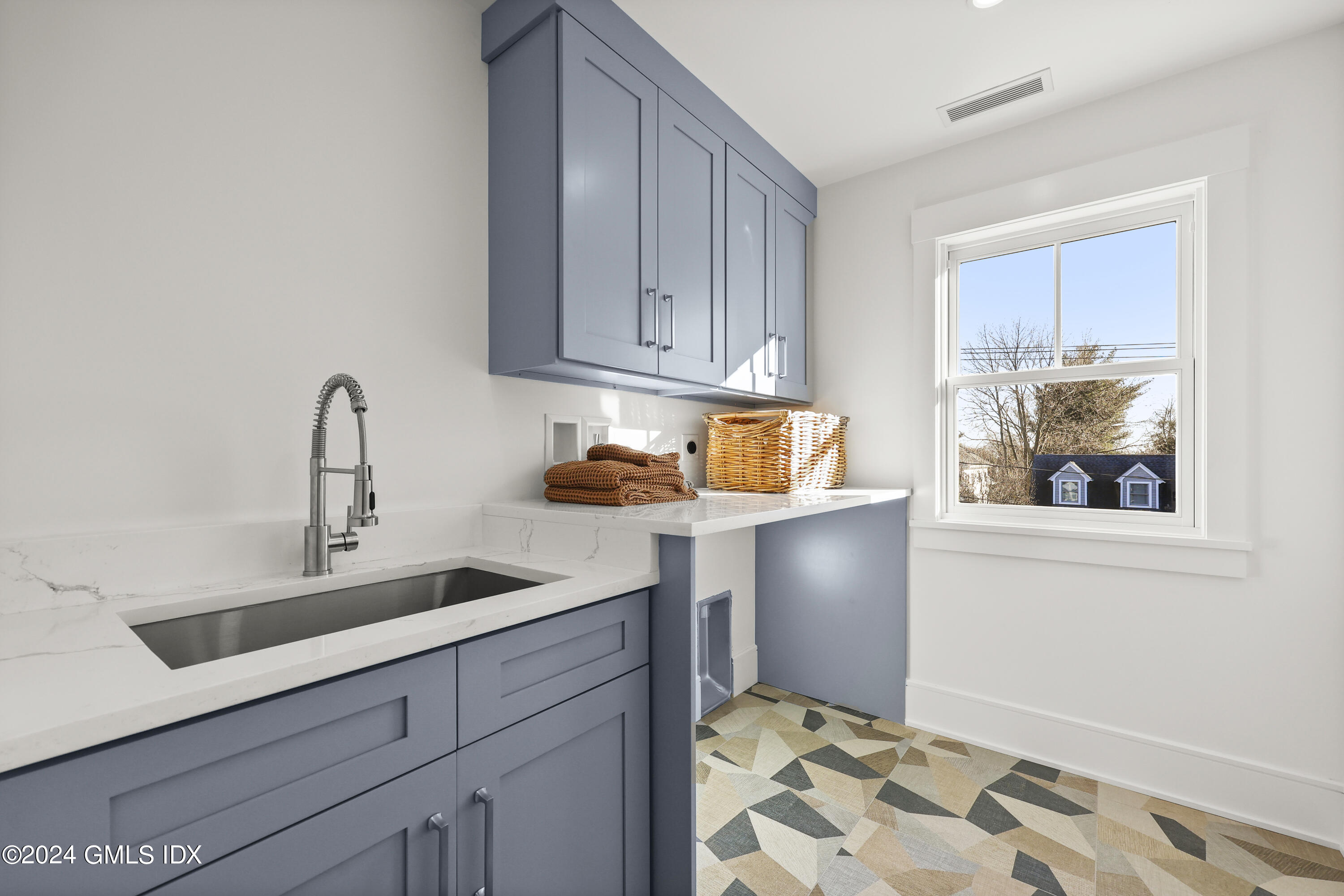 5 Northridge Road Old Greenwich, CT 06870 - Photo 23 of 32 a kitchen with a refrigerator and cabinets