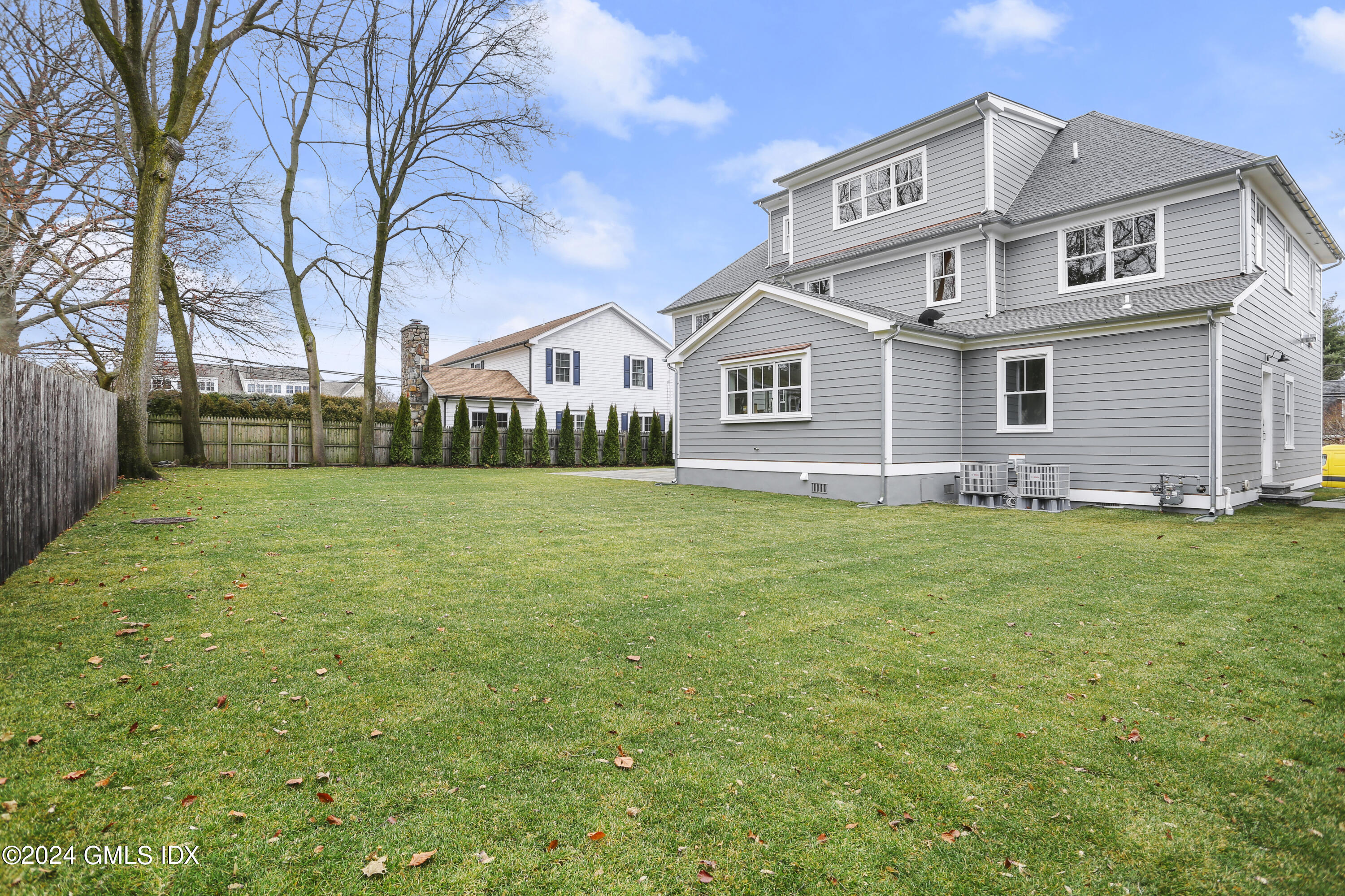 5 Northridge Road Old Greenwich, CT 06870 - Photo 27 of 32 a front view of house with yard and green space