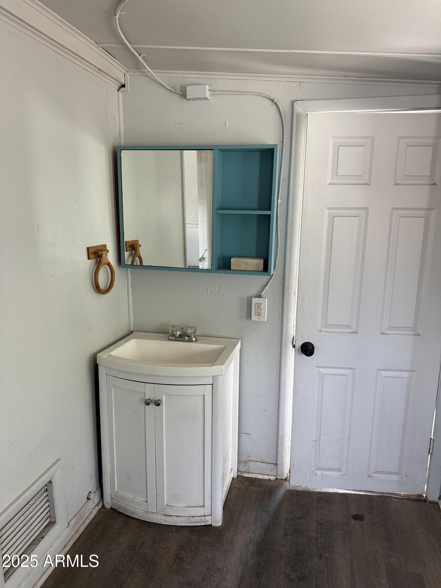1008 North 27th Street Phoenix, AZ 85008 - Photo 14 of 15 a bathroom with a sink a vanity and a mirror