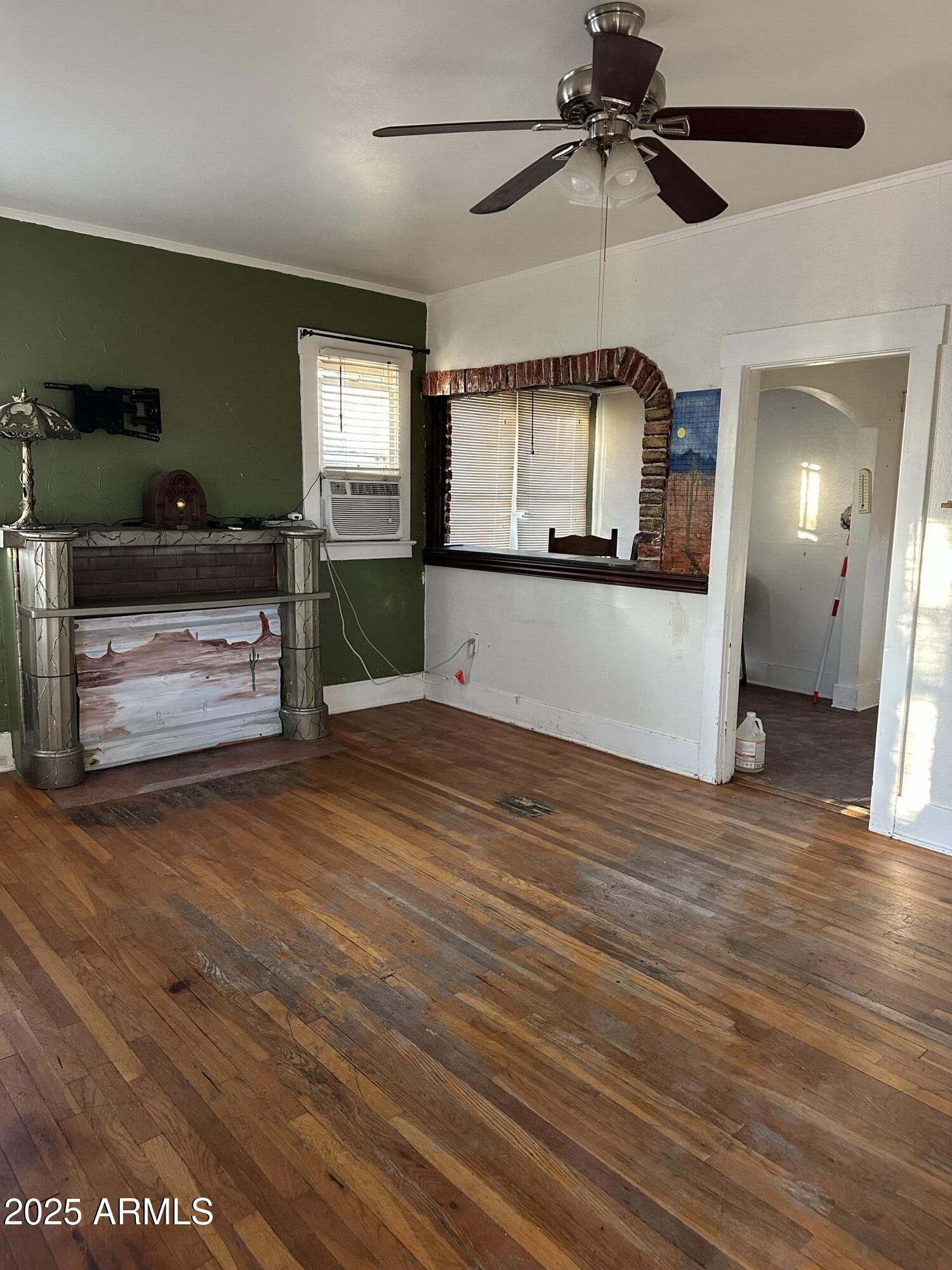 1008 North 27th Street Phoenix, AZ 85008 - Photo 3 of 15 a living room with furniture and a wooden floor