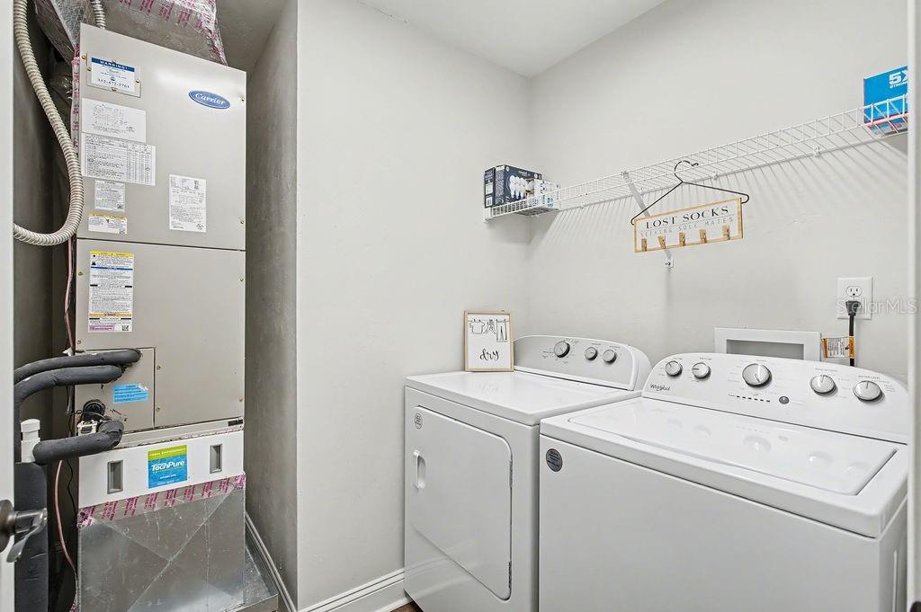 8291 Northeast 118th Terrace Bronson, FL 32621 - Photo 22 of 25 a utility room with dryer and washer