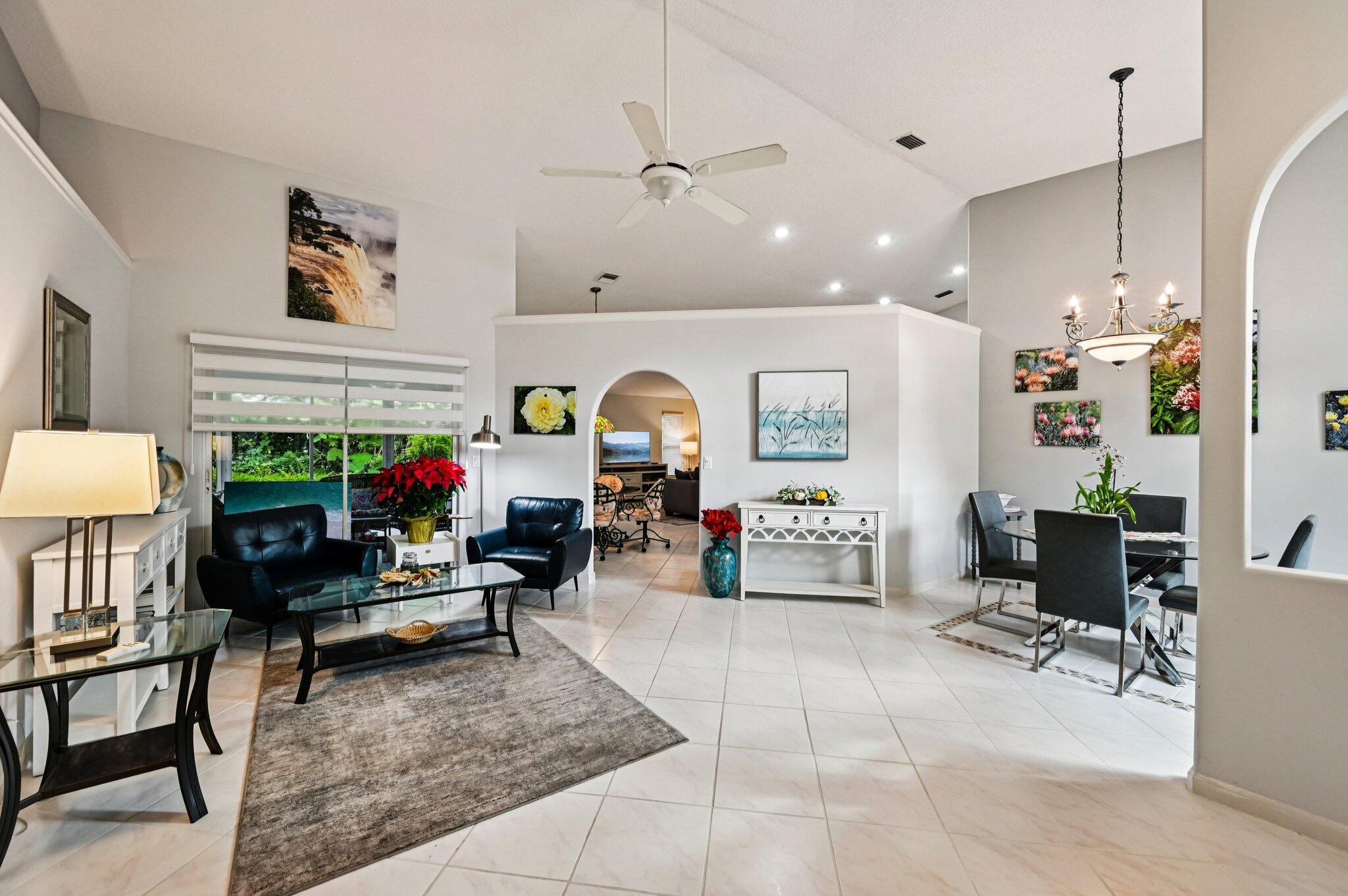 231 Sparrow Point Jupiter, FL 33458 - Photo 20 of 65 a living room with furniture and a fireplace