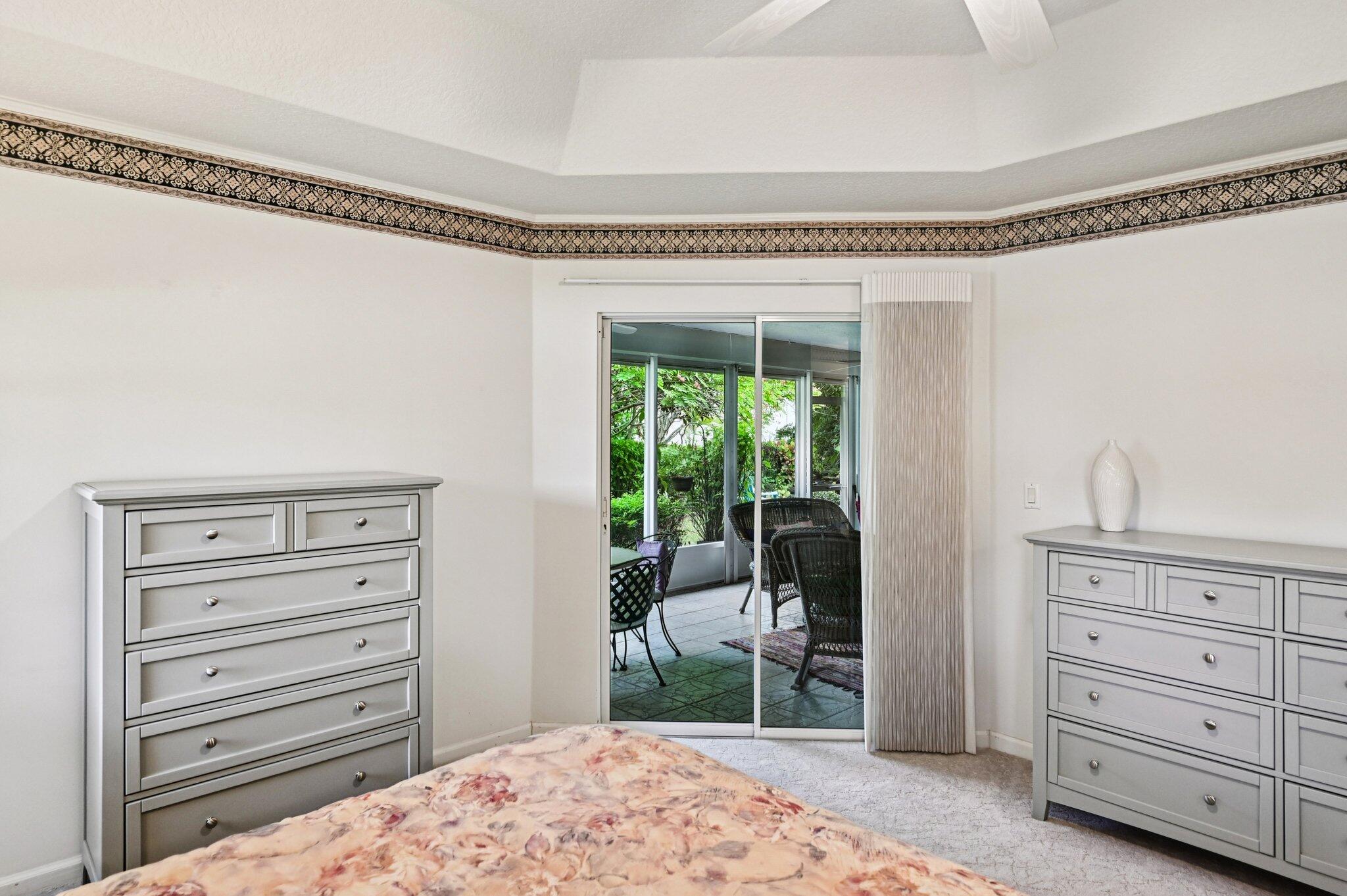 231 Sparrow Point Jupiter, FL 33458 - Photo 25 of 65 a bedroom with a dresser and a window