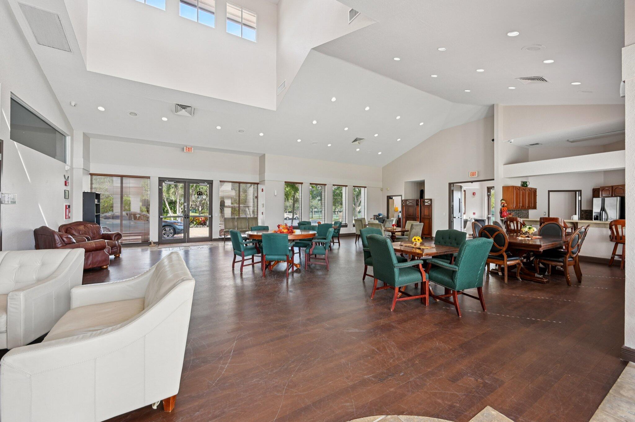 231 Sparrow Point Jupiter, FL 33458 - Photo 47 of 65 a living room with lots of furniture and a view of dining table with chairs