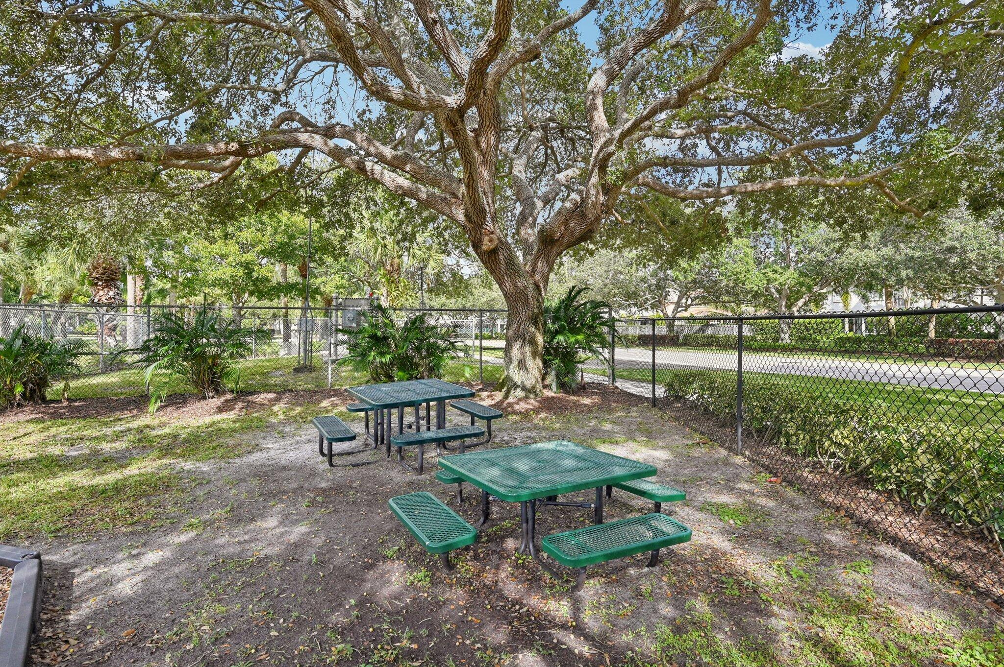 231 Sparrow Point Jupiter, FL 33458 - Photo 62 of 65 a view of a park with bench and trees