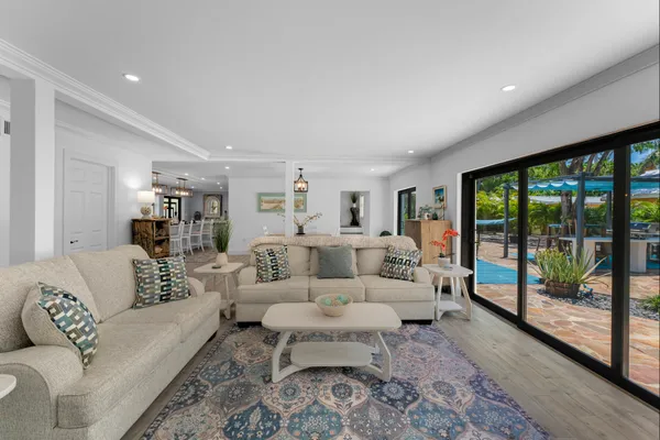 a view of yard with swimming pool and sitting area