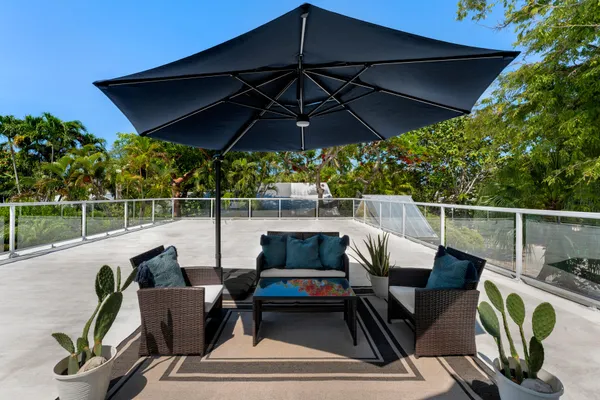 an aerial view of a house with a yard and garden