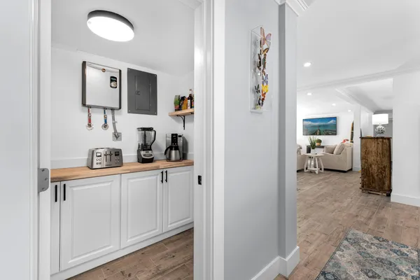 a kitchen with kitchen island a counter space a sink and appliances