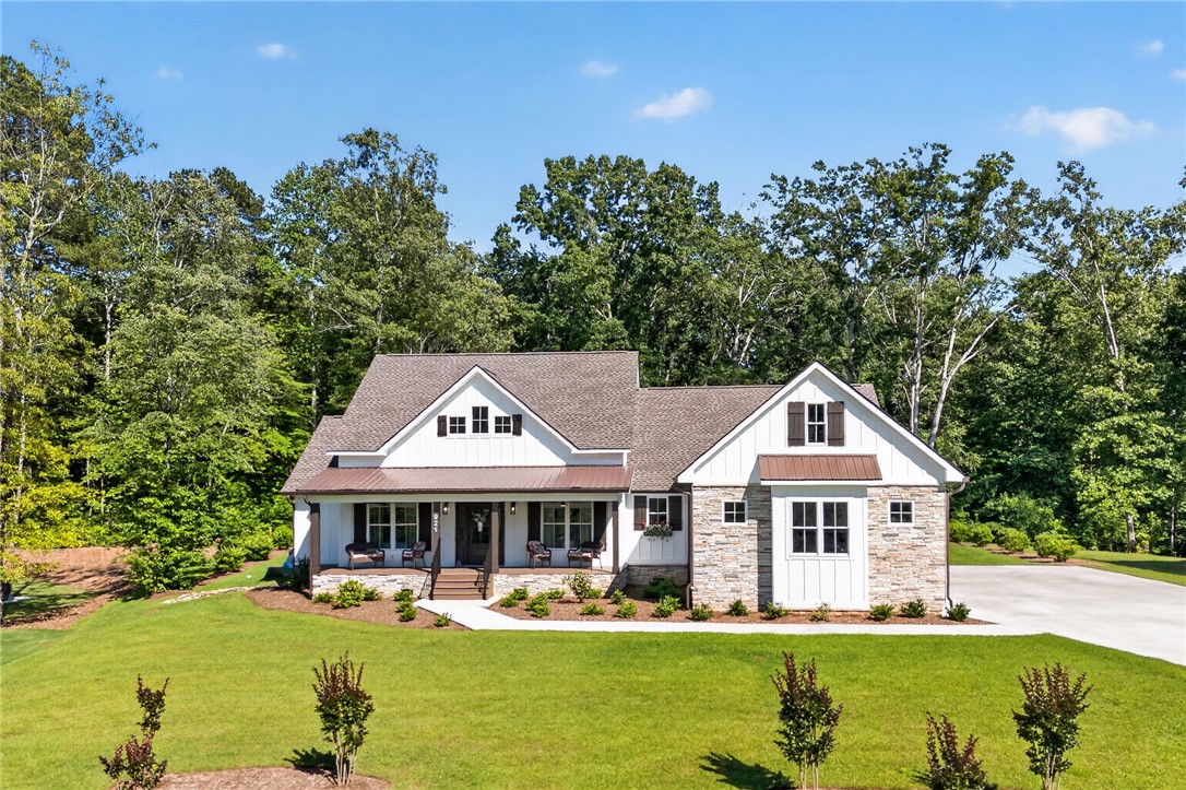 921 Falling Waters Lane Seneca, SC 29672 - Photo 1 of 46 This newly constructed home blends board and batten siding with stone accents, offering delightful curb appeal.